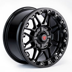Black alloy wheel with a brand logo on a white background